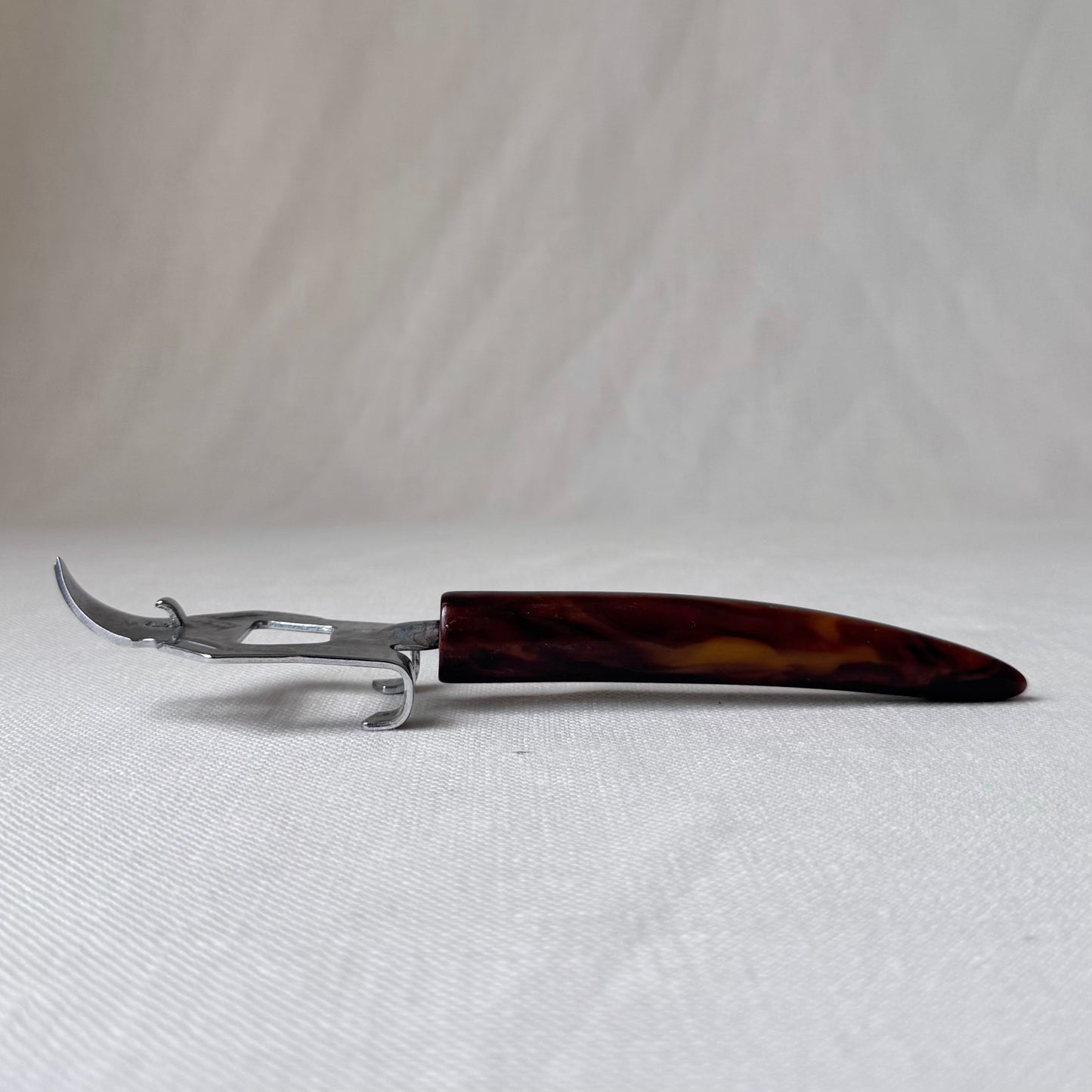 MCM Bakelite Swirl Handle Bottle Opener
