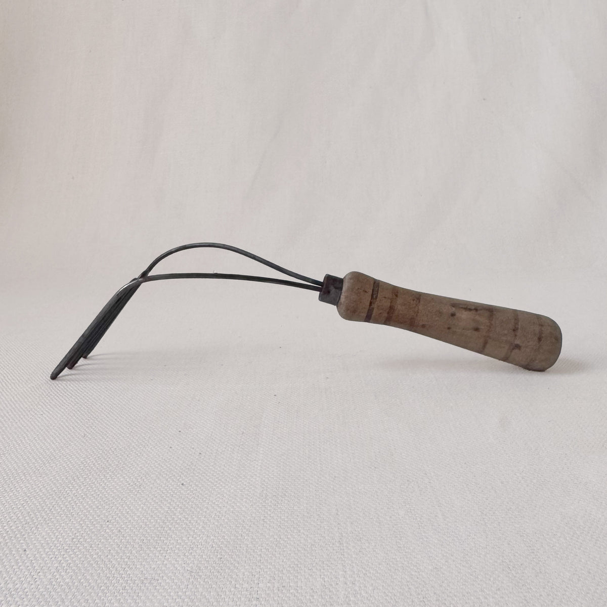 Antique Angled Masher