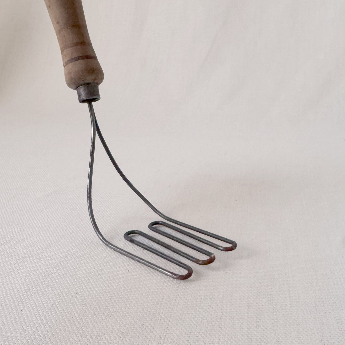 Antique Angled Masher