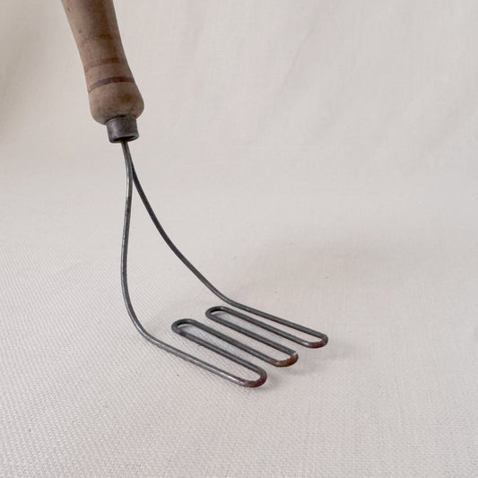 Antique Angled Masher