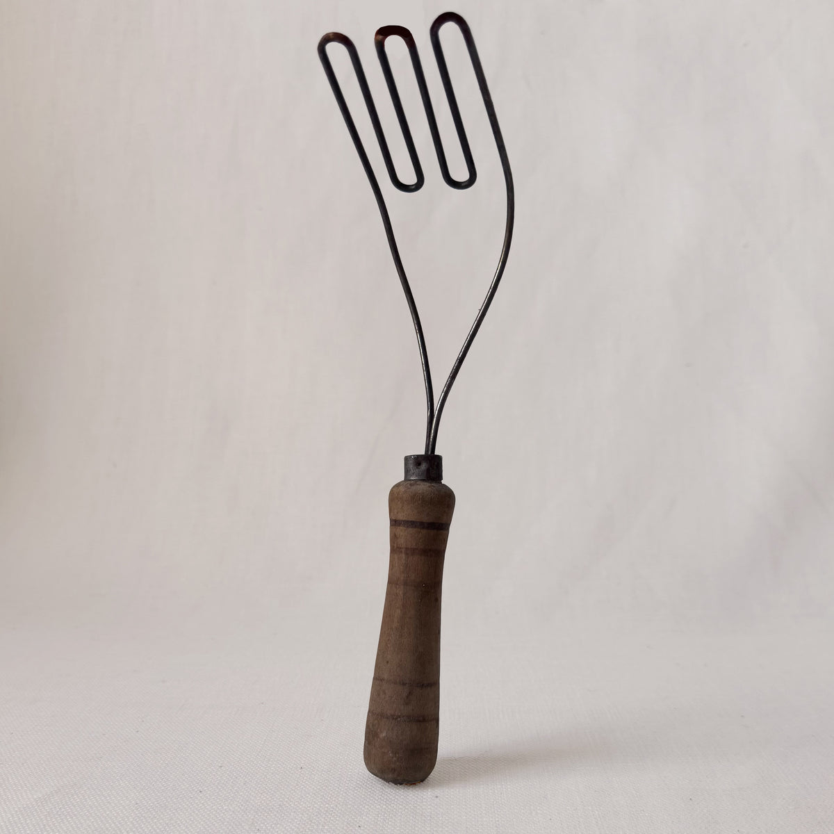 Antique Angled Masher