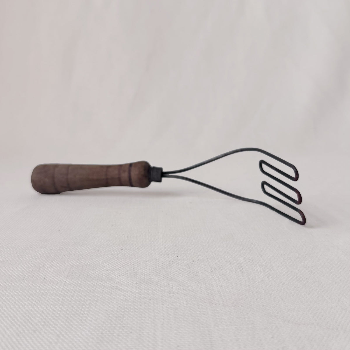Antique Angled Masher